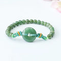Oil green jade bracelet with star-shaped beads and a silver safety buckle clasp.