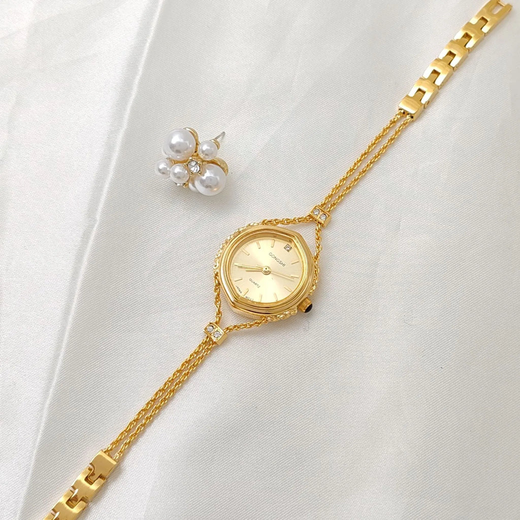 Women's Mori style quartz watch in gold or silver with a 25mm dial and chain strap.