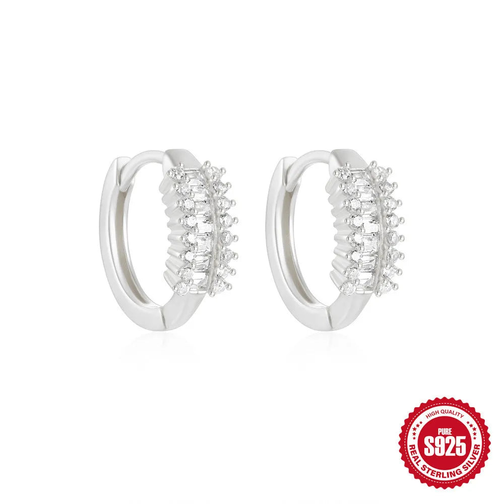 Geometric sterling silver stud earrings with small round diamond-inspired stones in gold and silver finishes