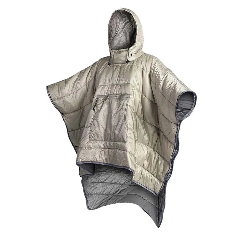 Grey outdoor cloak sleeping bag worn as a cape, showing its large 200x140cm size and hooded design.