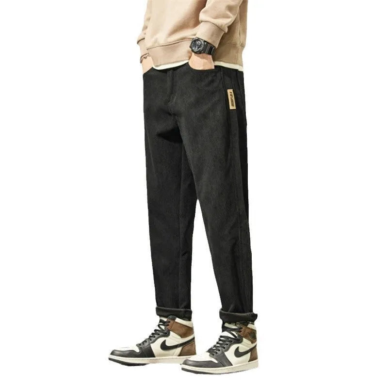 Men's corduroy casual trousers in tapered straight-leg style with mid waist and zipper fly closure