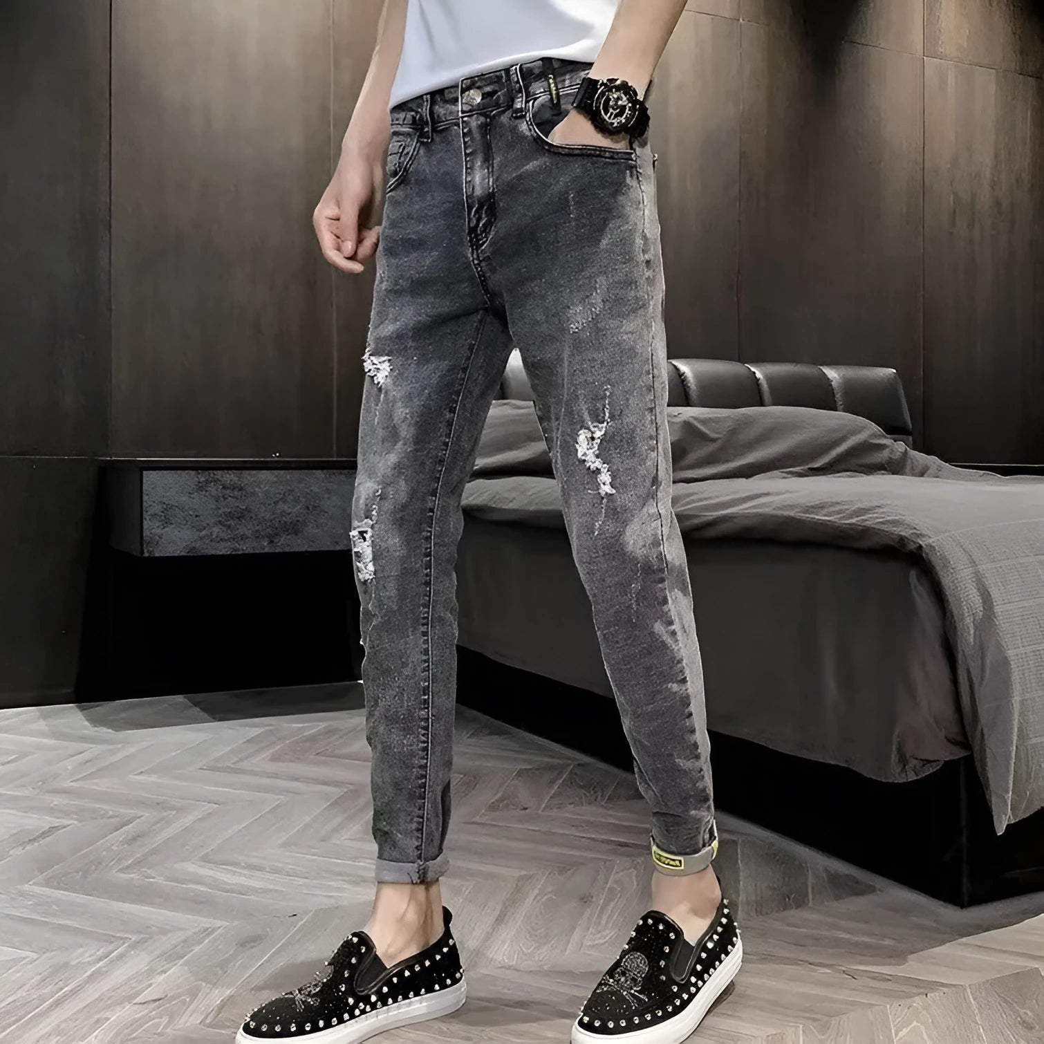 Man's high-waist blue denim jeans with a button fly on a plain background.