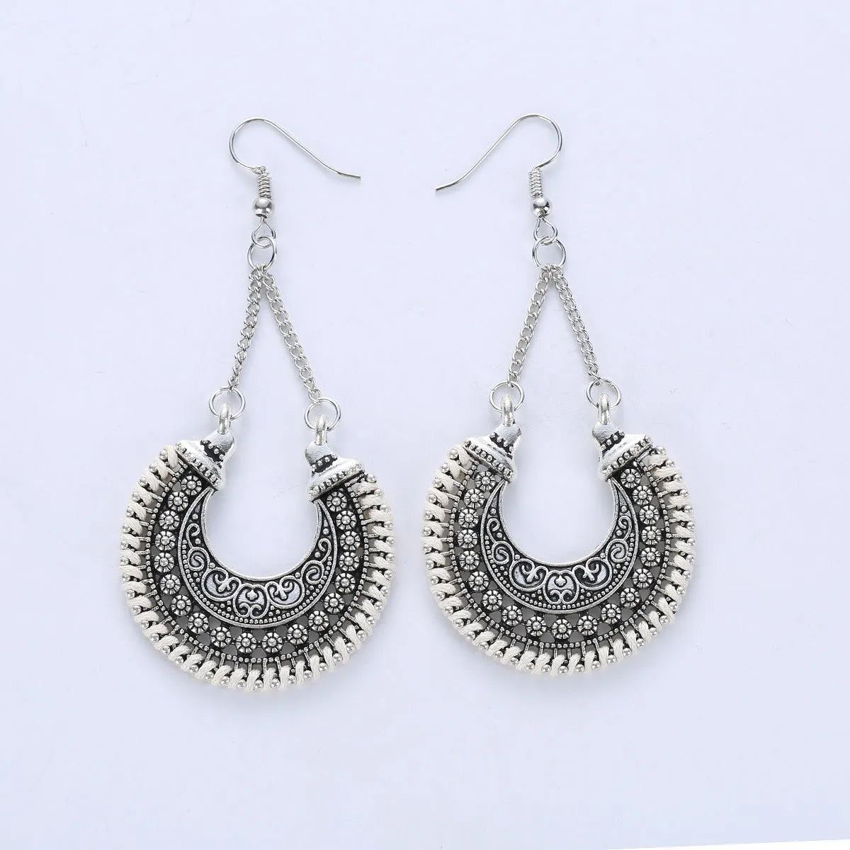 Bohemian vintage alloy and rope U-shaped drop earrings with hollow carved meniscus flower basket design, 5.8cm length, 3.8cm width