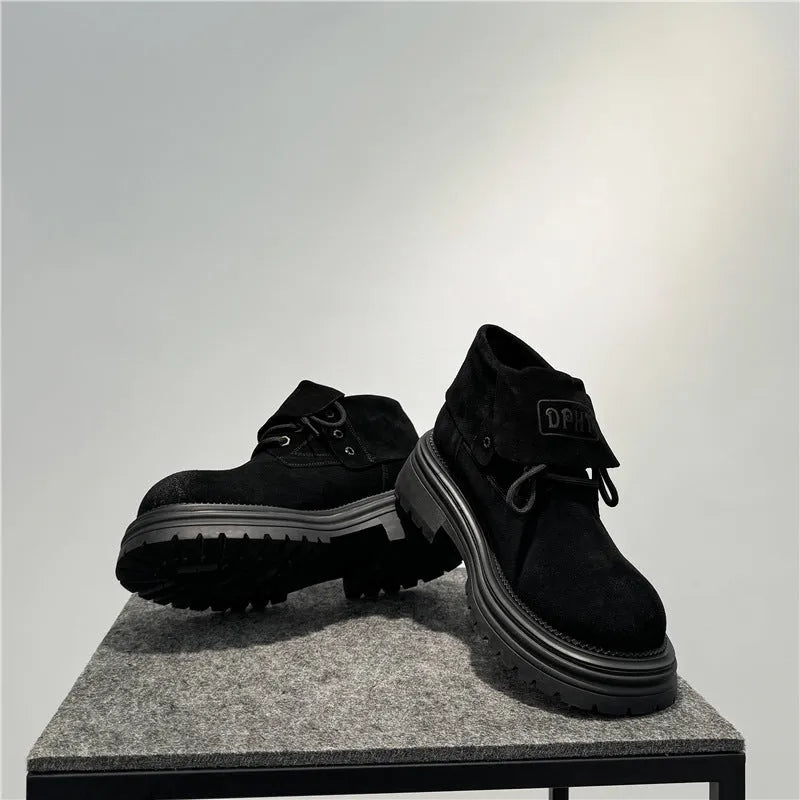Retro distressed worker style boots in cow suede with thick soles and visible sewing lines