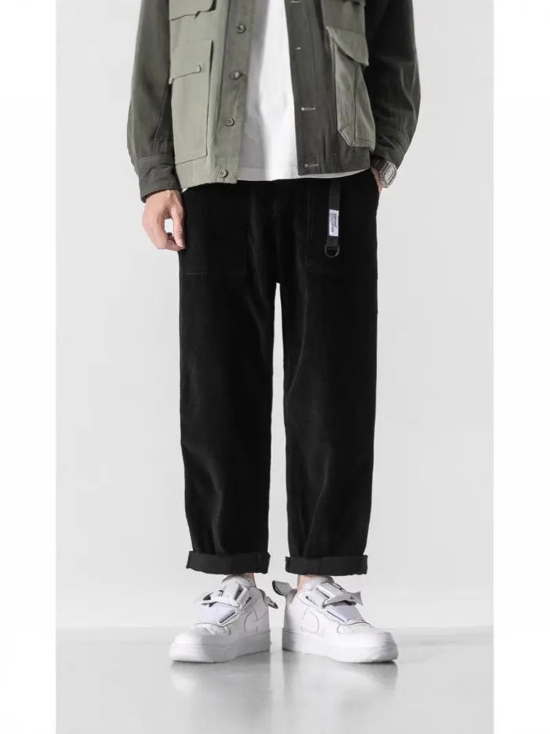 Loose straight tapered trousers with wide legs in dark grey, black, and khaki colours