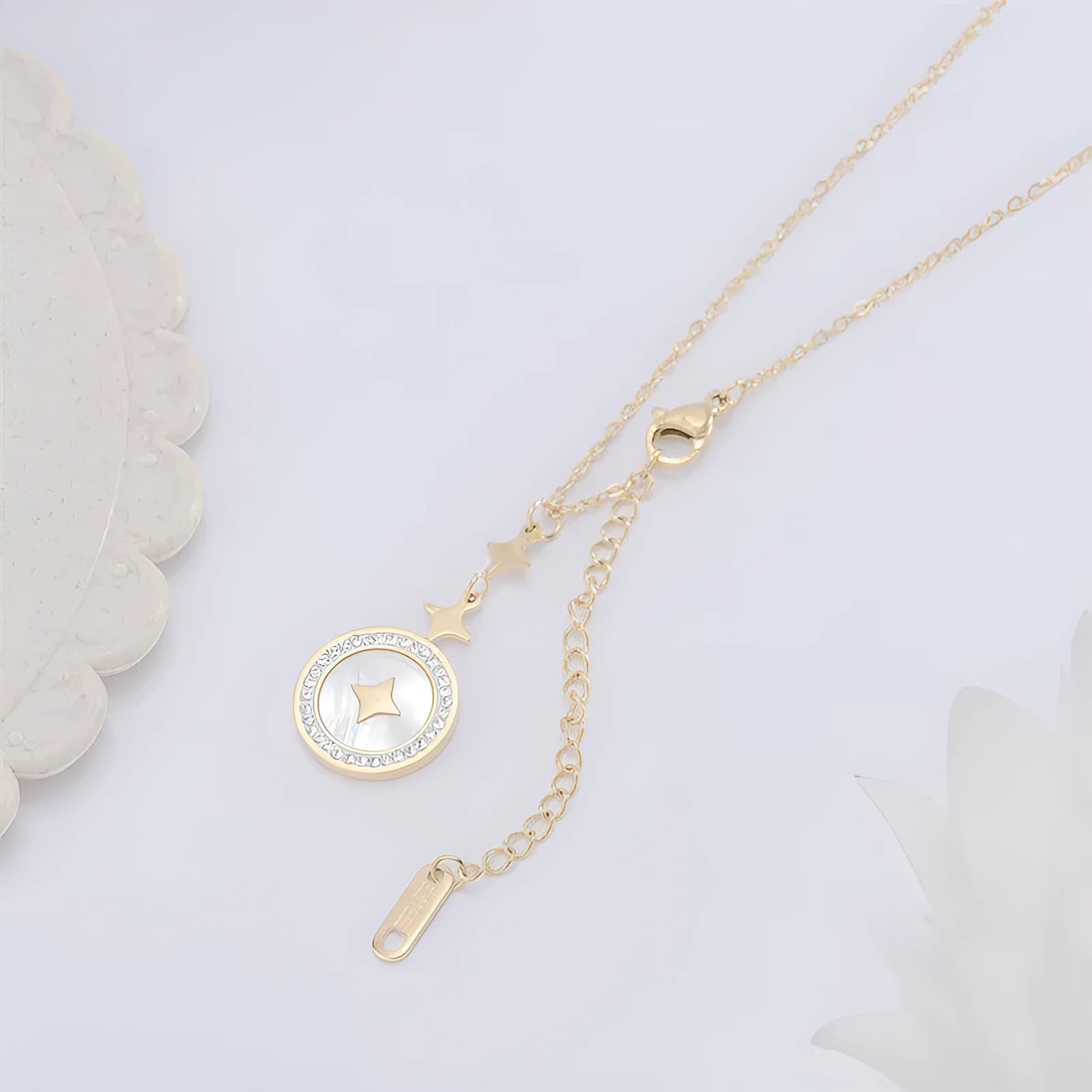 Close-up of a women's geometric six-pointed star titanium steel necklace on a model, showing rose gold and gold colour options.