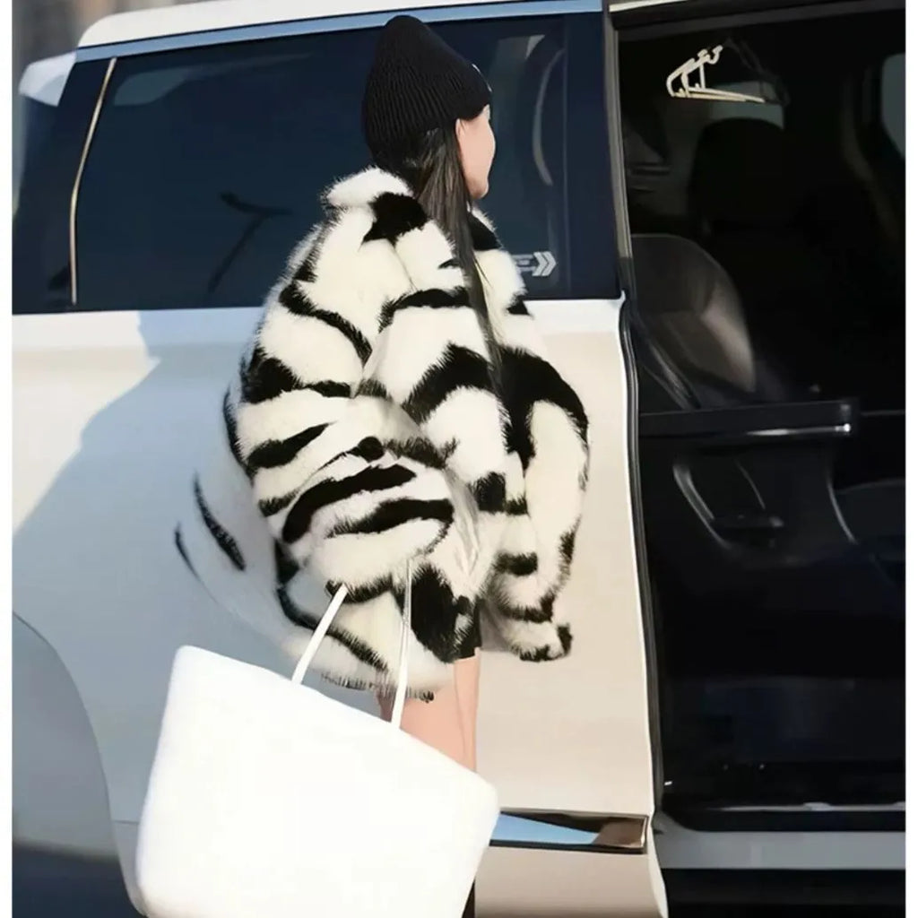 Women's zebra stripe pattern fur top with large skimmer collar and long sleeves in street fashion style