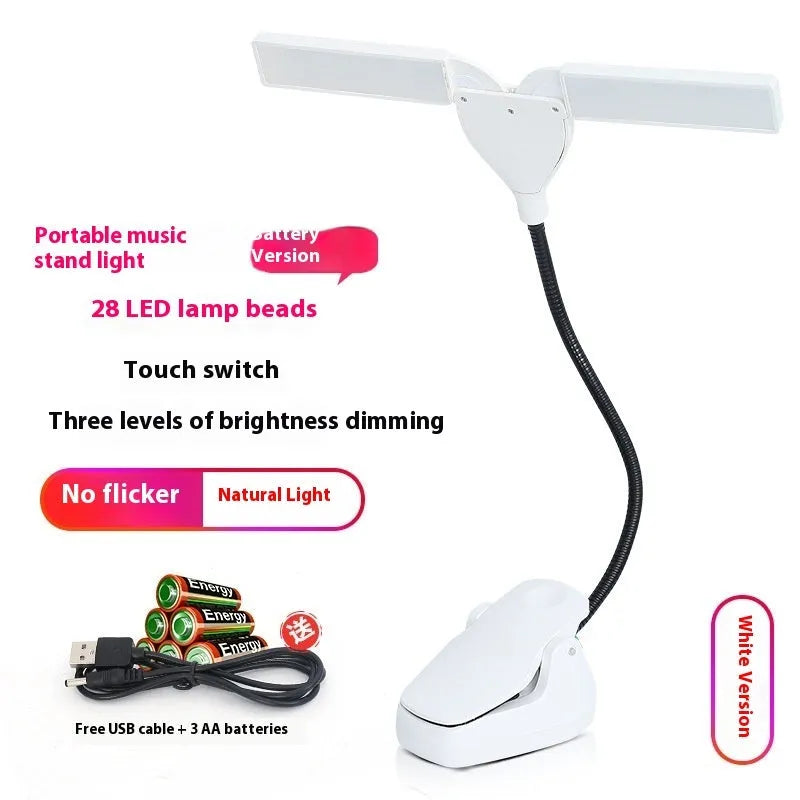 Black rechargeable music stand light with 28 LEDs and USB cable on a music stand.
