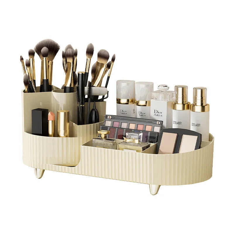 Rotating cream and black cosmetics organiser box holding makeup brushes and lipsticks on a table.