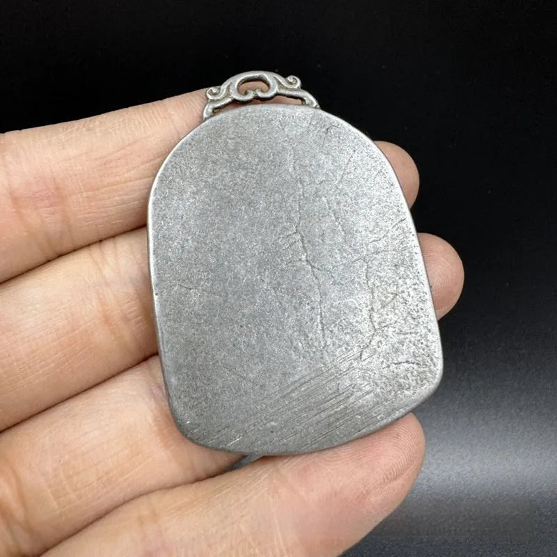 Chinese style antique iron geometrical hanging ornament pendant on a wall.