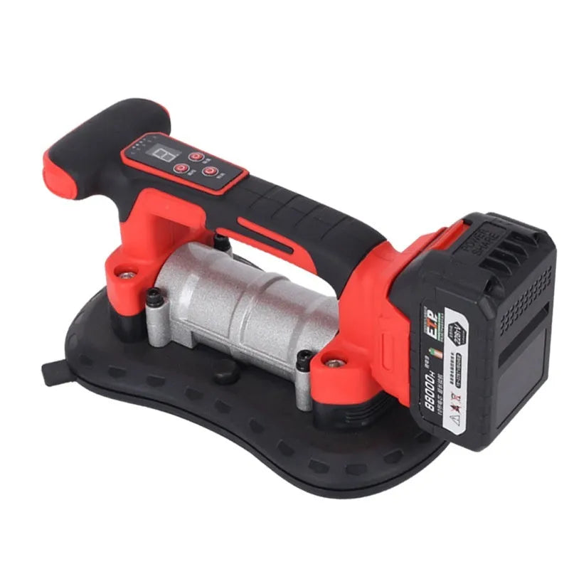 Cordless 21V electric tile laying machine with battery on a large format tile.