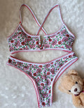 V-neck swimsuit with floral embroidery and printed patterns in brief cut design