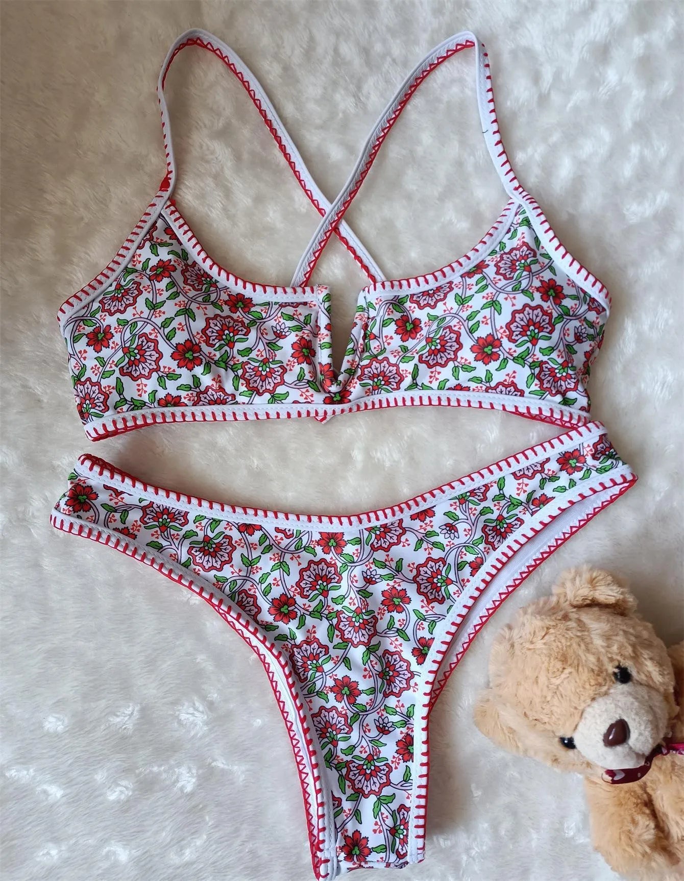 V-neck swimsuit with floral embroidery and printed patterns in brief cut design