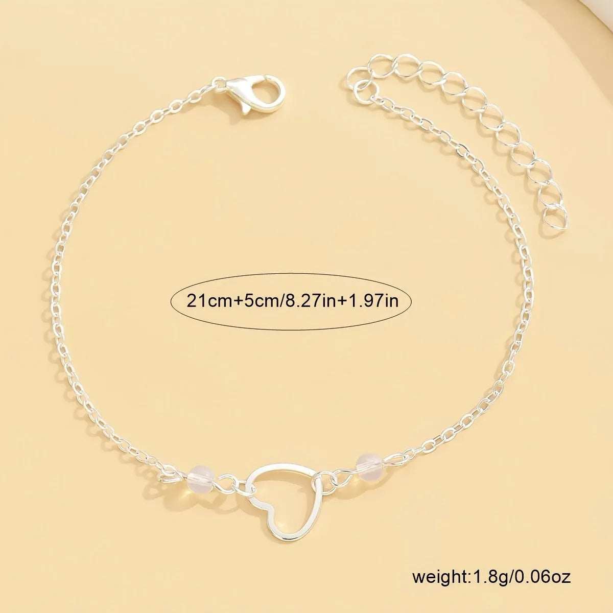 Women's geometric anklet with heart pendant on adjustable alloy chain in gold or silver finish