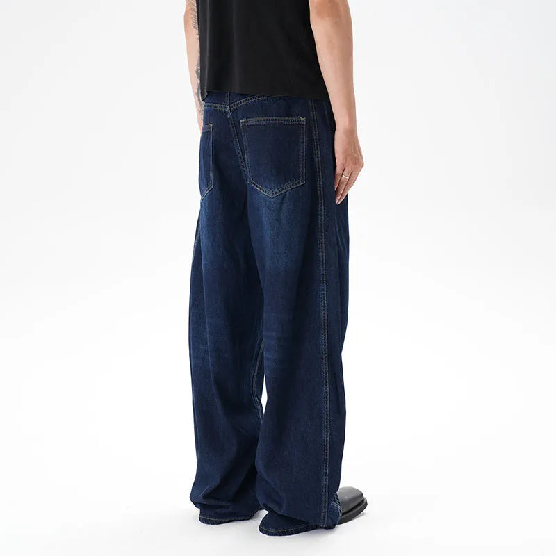 Dark blue wide leg women's jeans with a machete cut and distressed detailing on denim fabric.