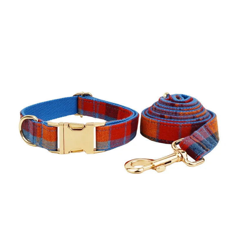 Blue velvet plaid cloth dog collar and matching leash set on a neutral background