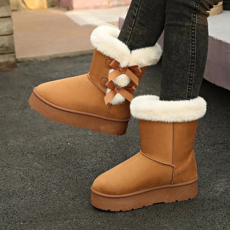 Women's black suede fleece lined ankle boots with bow, side view showing high-top shaft