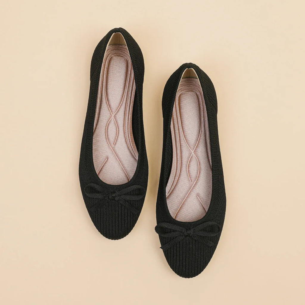 Women's casual flat pumps with fabric upper, butterfly bow, round toe, and flat viscose sole.
