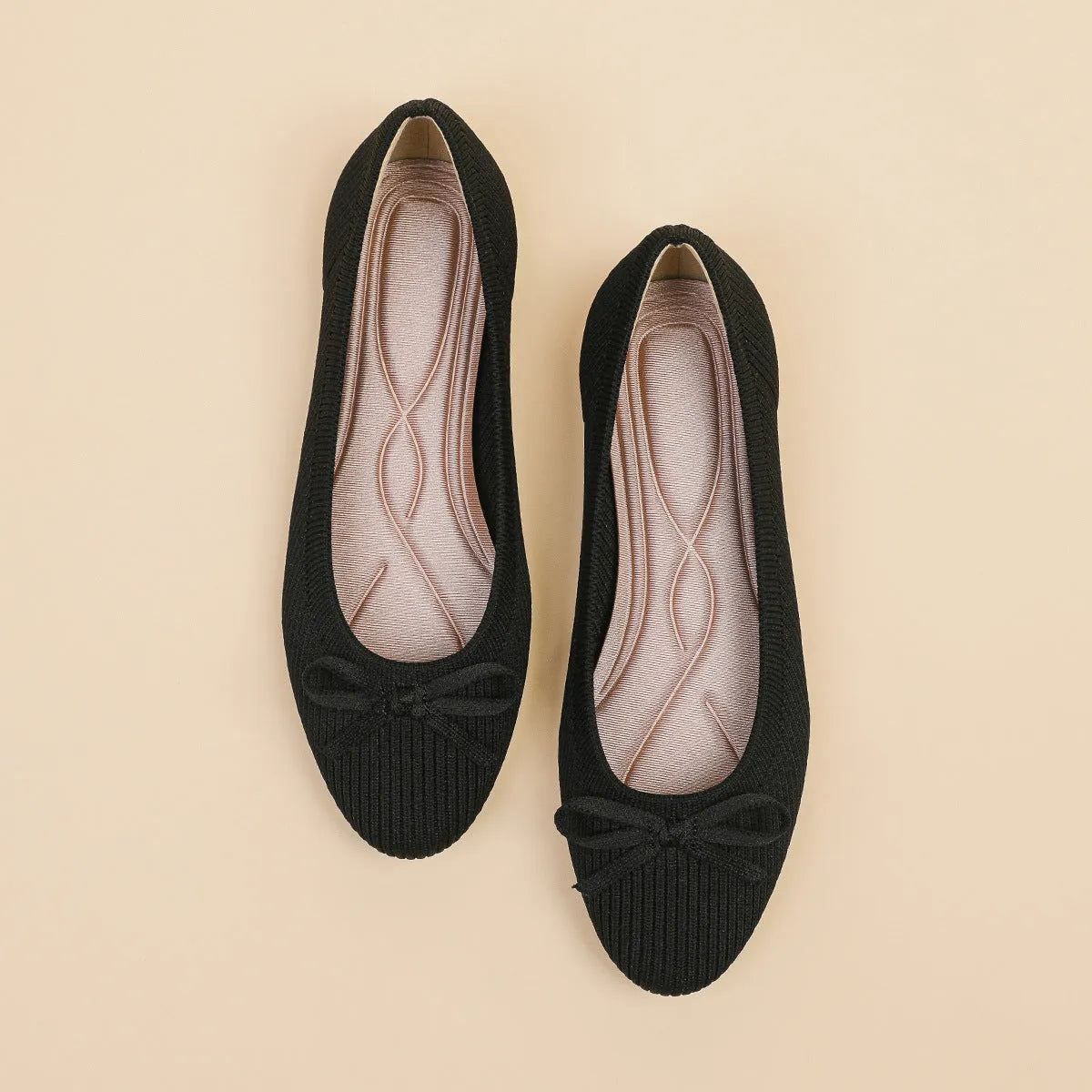 Women's casual flat pumps with fabric upper, butterfly bow, round toe, and flat viscose sole.