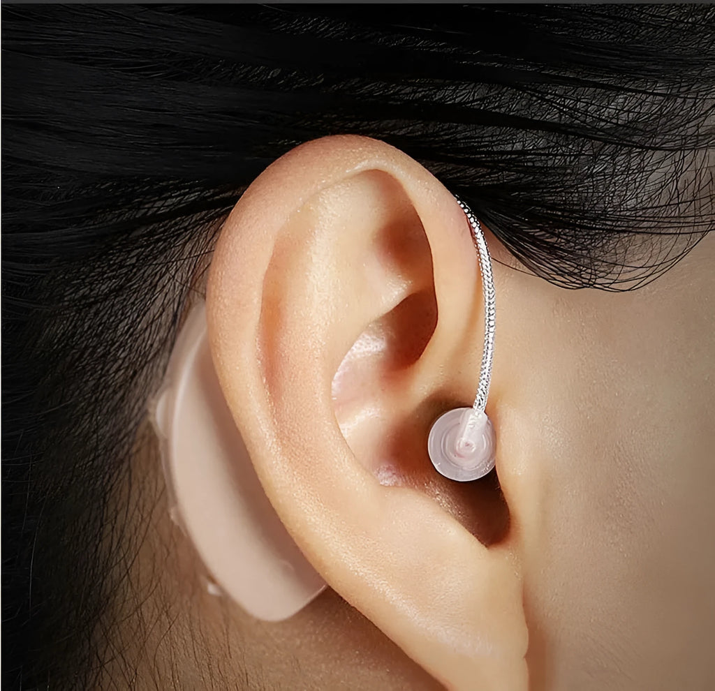 Black silicone rechargeable hearing aid amplifier with USB charging cable for the elderly.