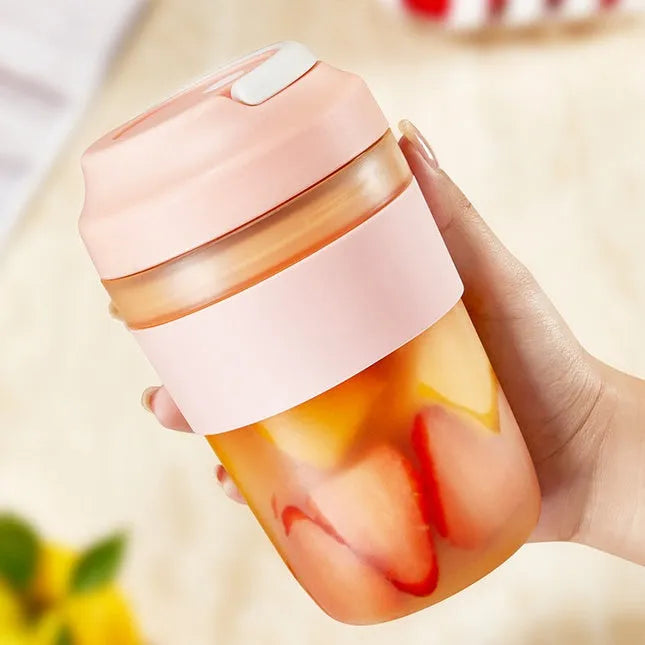 Grape purple portable USB blender cup with lid, showing stainless steel blades inside 400ml capacity bottle.