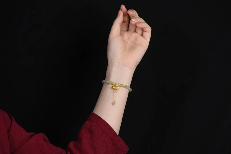 Natural Hetian jade bracelet with 6mm lotus beads and fu character element
