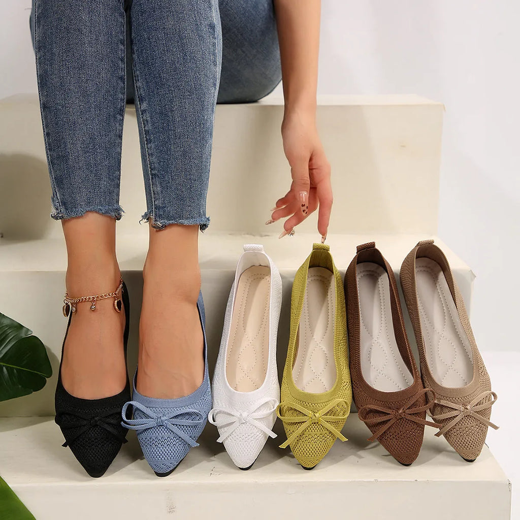 Women's knitted flat shoes with a pointed toe and decorative bow, shown in multiple colour options.