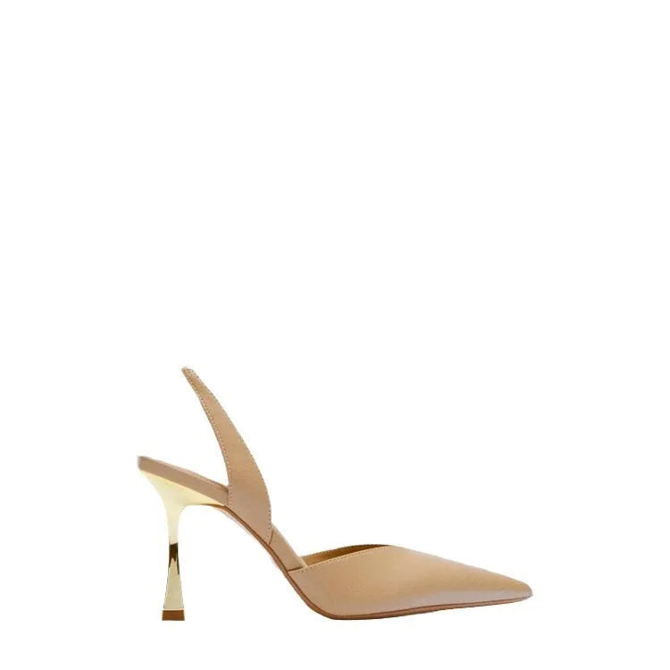 Women's nude apricot pointed toe patent leather high heels on a white background.