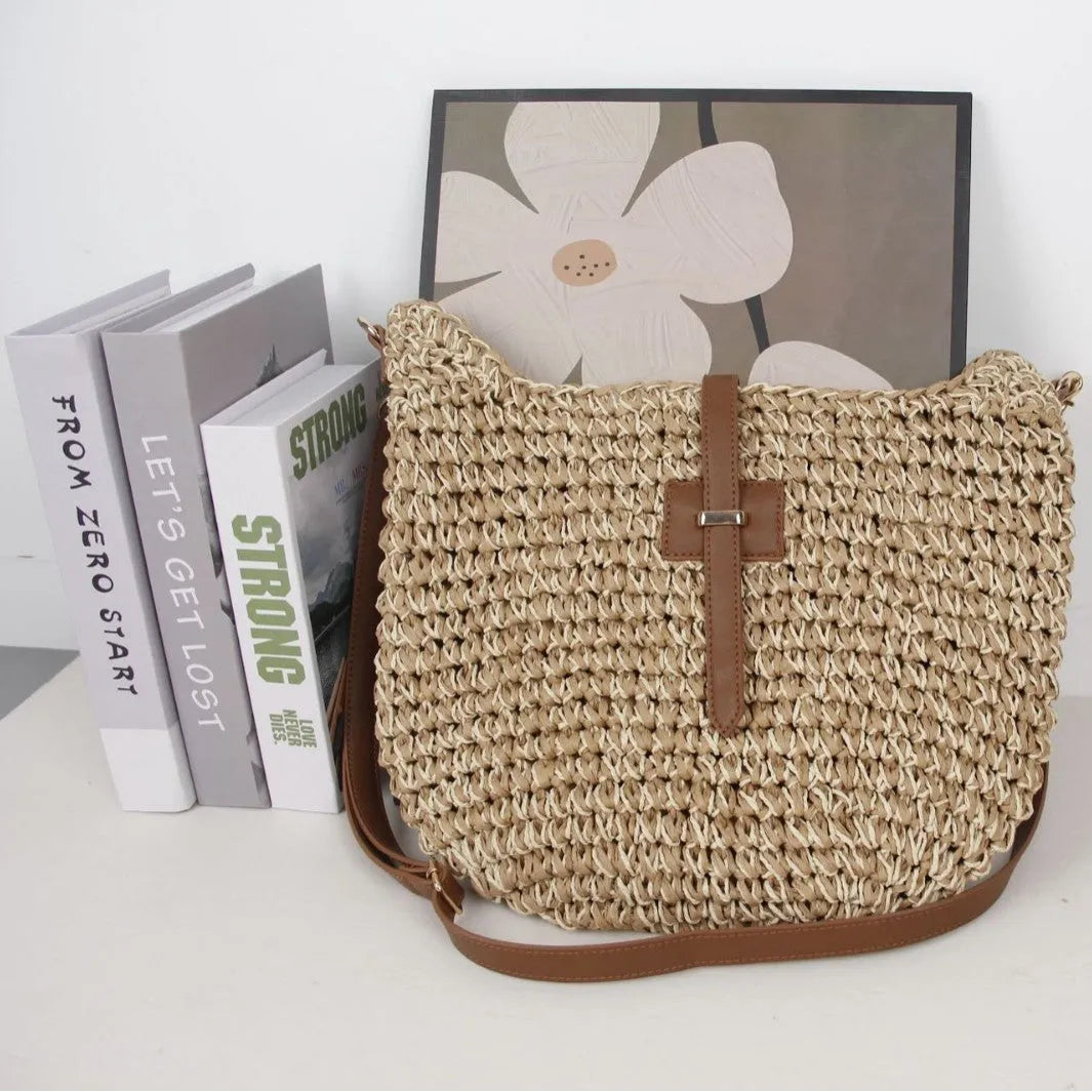 Beige handmade woven crossbody bag with a sandwich pocket and adjustable shoulder strap.