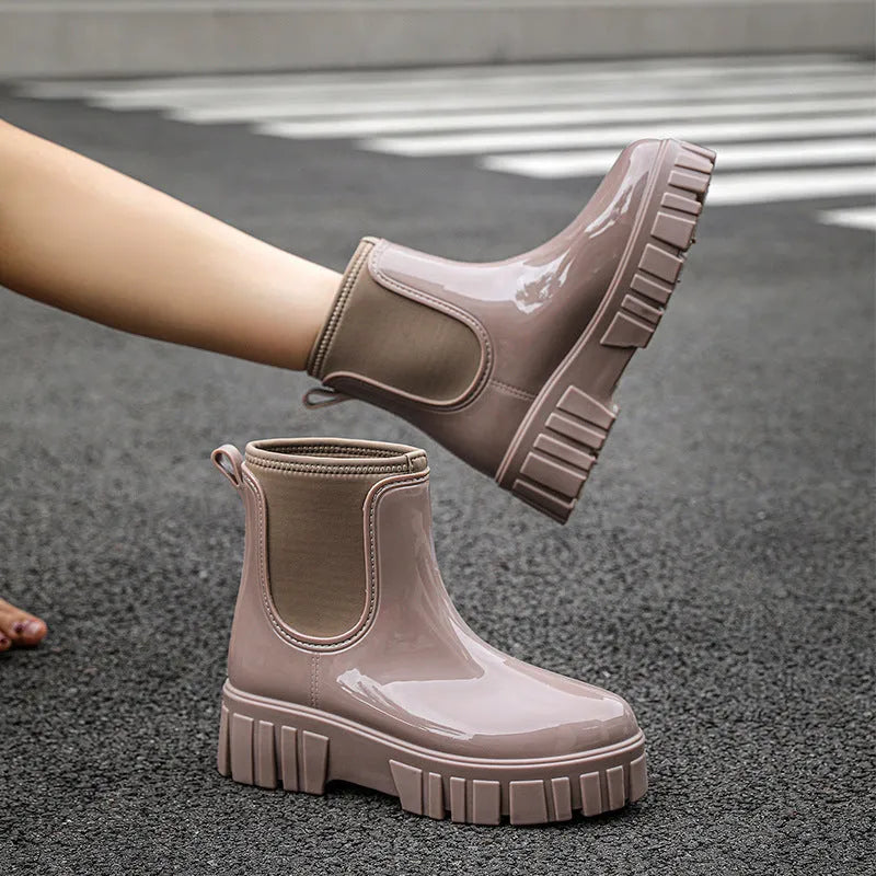 Low tube PVC rain boots in apricot colour with a non-slip sole and flat heel.