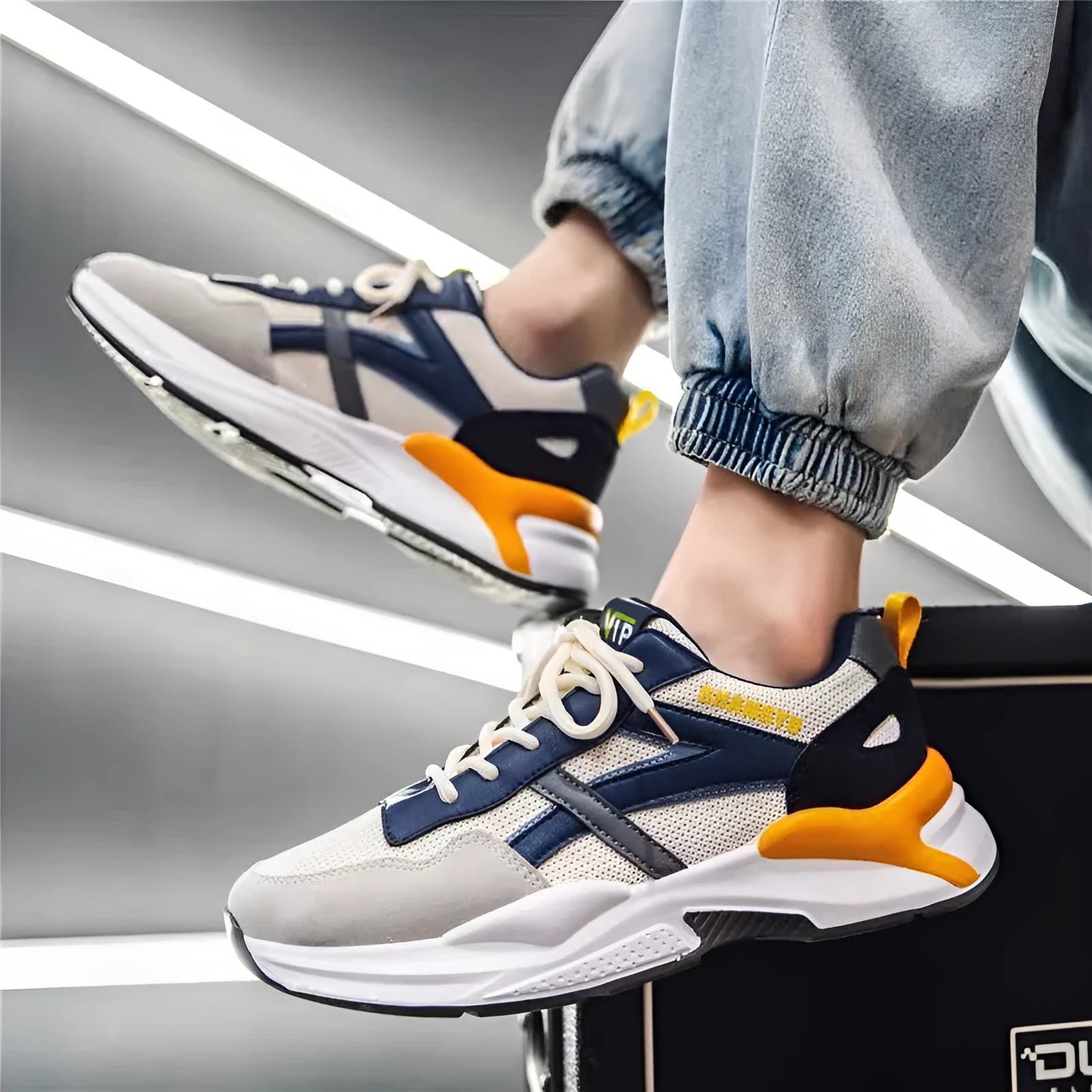Men's low-top breathable running sneaker with mesh upper, orange and yellow options, injection moulded sole