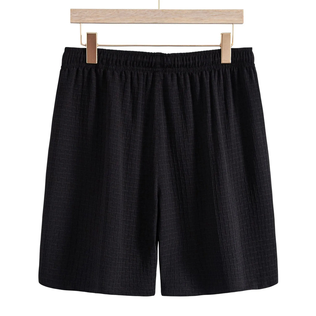Men's black cotton blend short sleeve shirt and shorts casual suit set on a white background.