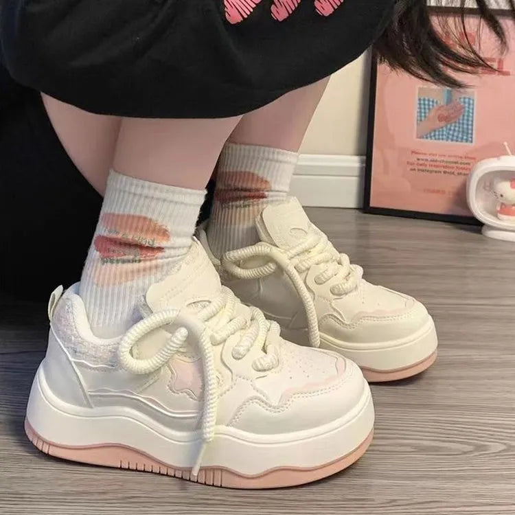 Women's green platform sneakers with lace-up front and round toe design on rubber sole