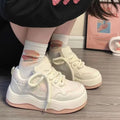 Women's green platform sneakers with lace-up front and round toe design on rubber sole