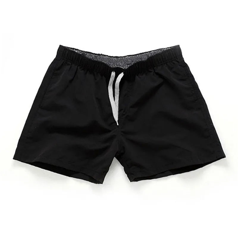Men's plus size polyester beach shorts in black, showing straight leg opening.
