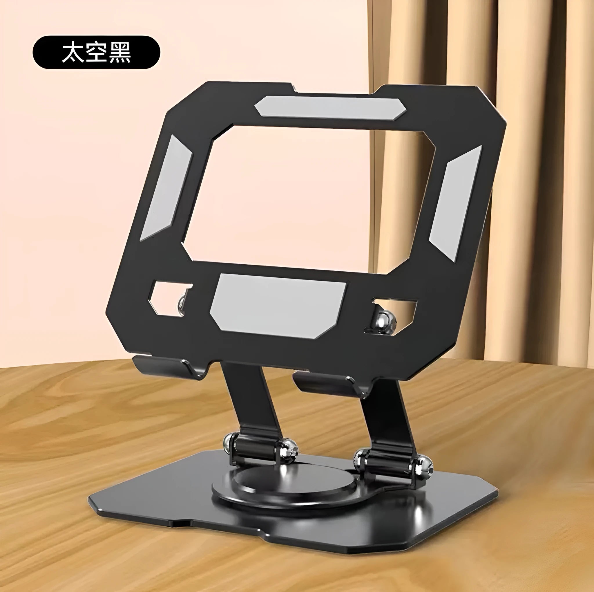 Black height-adjustable foldable laptop stand with heat dissipation grid, supporting a laptop on a desk