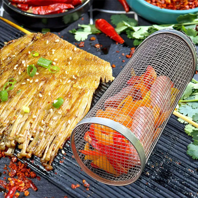 Stainless steel cylindrical rolling barbecue basket with wire mesh for grilling vegetables and meat.