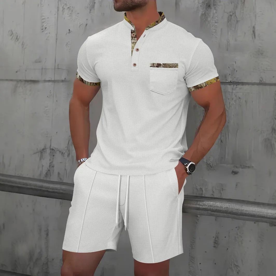 Men's grey waffle weave zippered polo collar short sleeve top and matching shorts suit set laid flat.