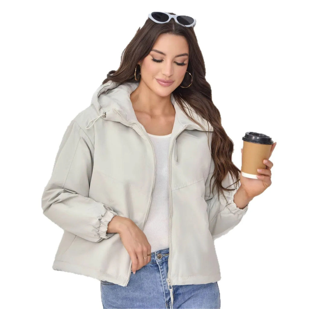 Women's loose-fit hooded shell jacket in grey, black, or purple colours, made from polyester fabric.