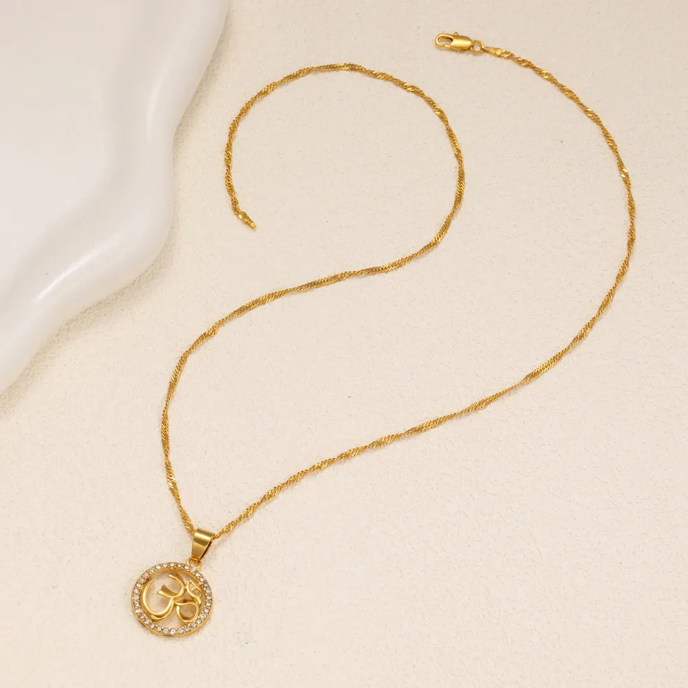 Gold plated copper circular pendant necklace with diamond edge inlay and OM symbol