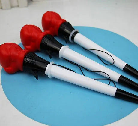 Four black gel pens with pressure relief boxing press ejection mechanisms