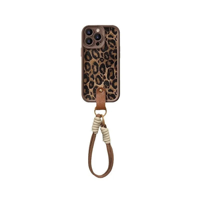 Brown leopard print silicone lanyard phone case for iPhone on a table