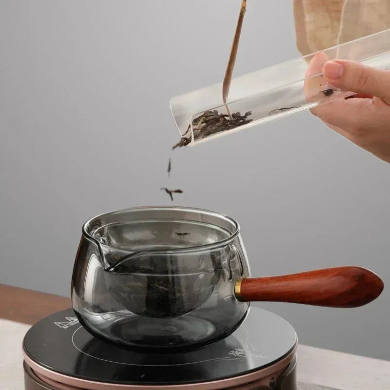 Semi-automatic rotary glass teapot with wooden handle and infuser, in grey and transparent colour options.