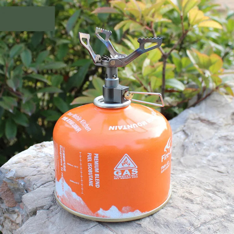 Portable mini camping gas stove in silver metal, 25g weight, for outdoor propane cooking