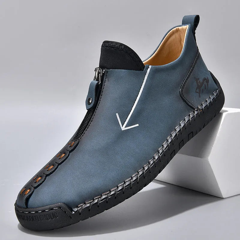 Men's black front zip Martin style boots with round toe and low rubber sole.