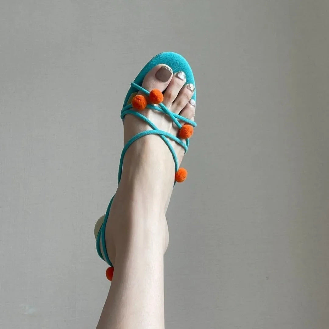 Cyan high-heeled sandals with thin strap lace-up design and open toe made from genuine French leather
