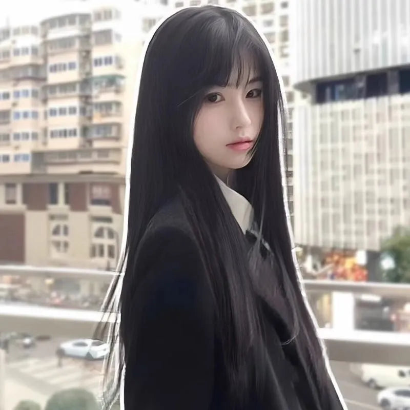 Long straight black synthetic wig with full blunt bangs on a wig stand.
