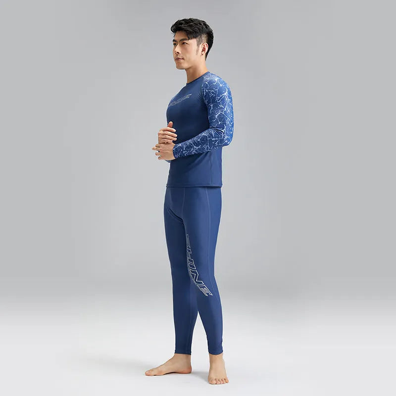 Men's dark blue patterned nylon swimwear set consisting of a top and trousers.
