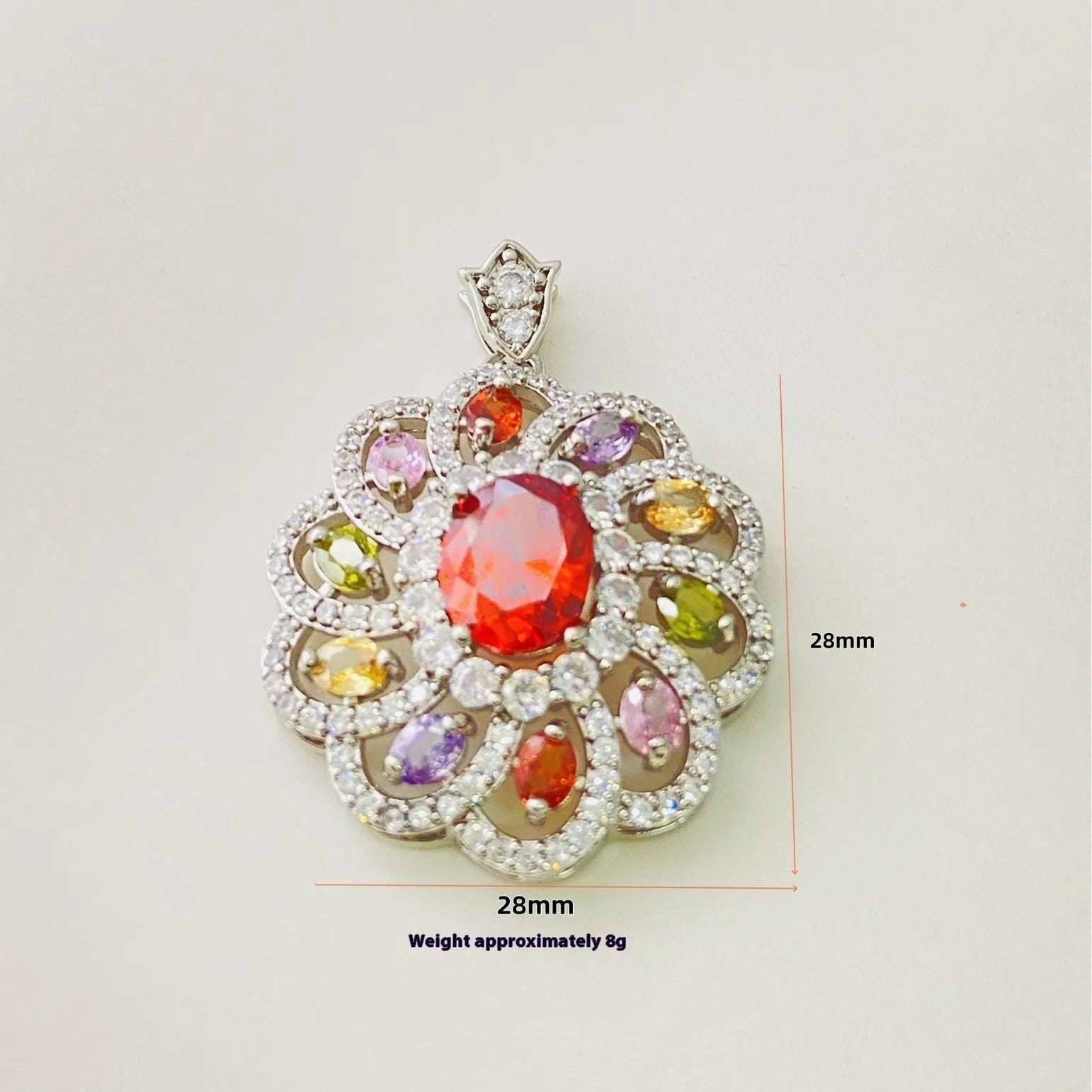 Close-up of a women's floral-shaped colourful zircon pendant necklace in a gold metal setting.