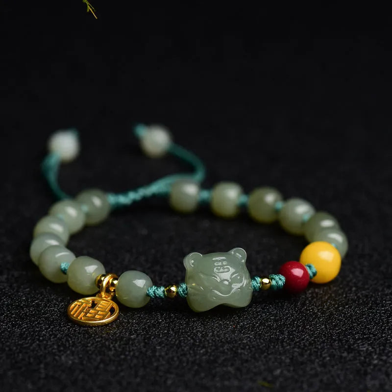 Natural Hetian Jade bracelet with cinnabar and beeswax beads in animal zodiac design.